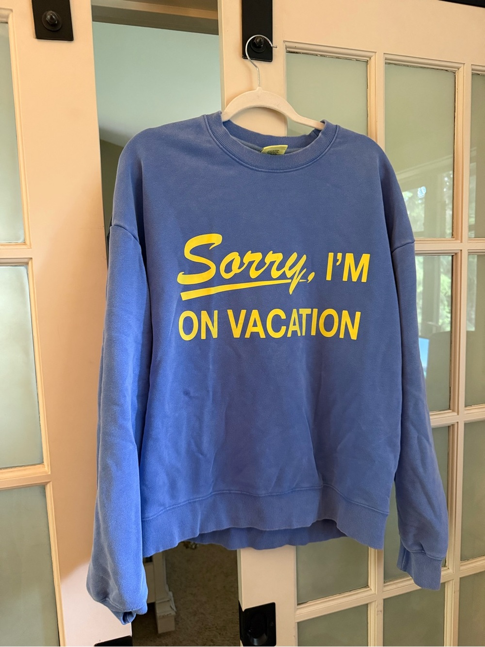 Blue Crewneck Sweatshirt with Yellow "Sorry, I'm On Vacation" Print